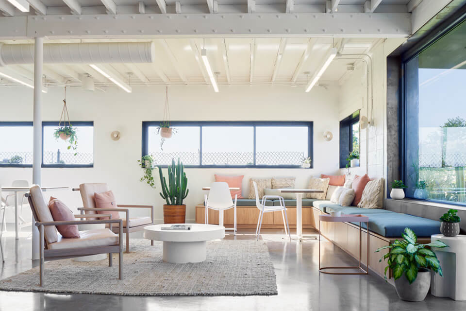 Modern linear LED suspension lights provide high-CRI lighting at The Commune creative coworking space in Austin, Texas